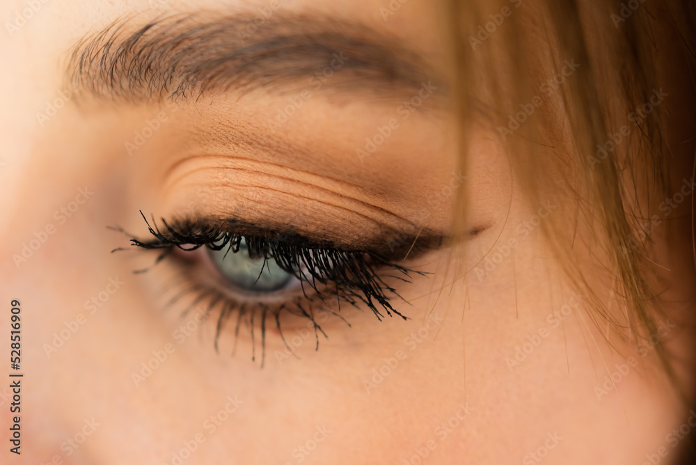 Naklejka premium Eyebrows of girl after plucking and haircut close-up. The makeup artist will do permanent eyebrow makeup. Makeup and cosmetology concept