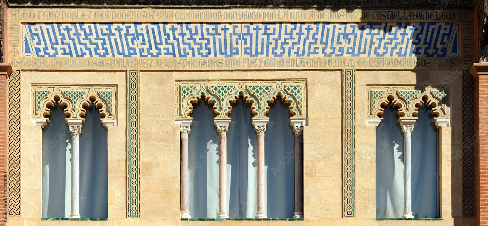 Fototapeta premium Mudejar architecture. Detail of the facade of the Palace of King Don Pedro. Alcazar of Seville, Spain. Unesco World Heritage