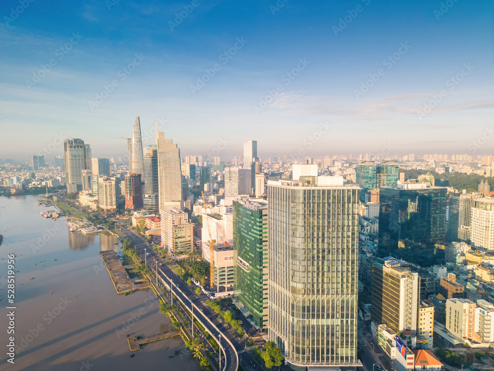 Aerial view of Ho Chi Minh City skyline and skyscrapers on Saigon river, center of heart business at downtown. Morning view. Far away is Landmark 81 skyscraper