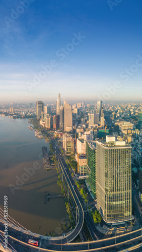 Aerial view of Ho Chi Minh City skyline and skyscrapers on Saigon river  center of heart business at downtown. Morning view. Far away is Landmark 81 skyscraper