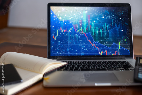 Laptop and pen with business charts, graphs, statistic and documents background for education and business concepts © Angelov