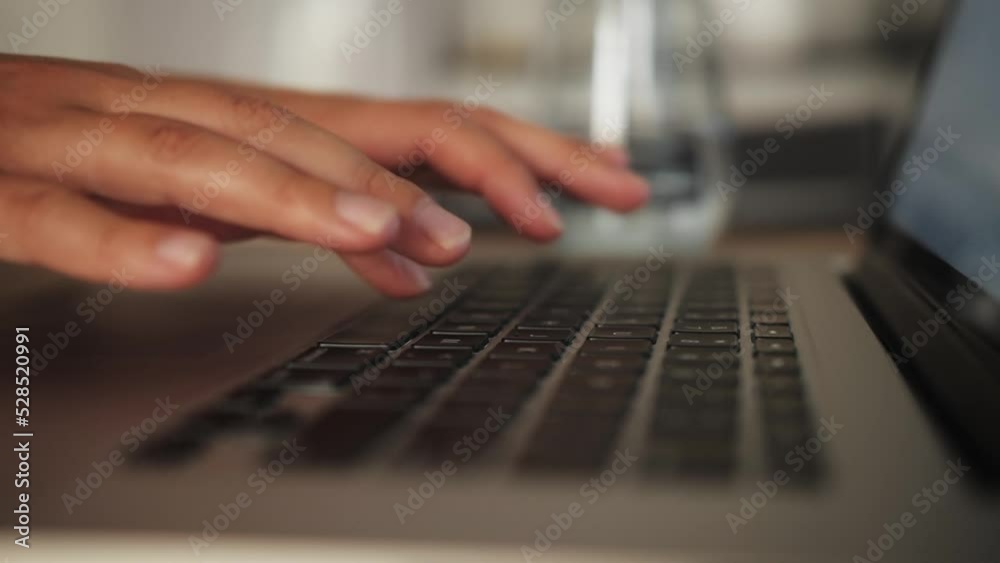 Freelancer working on laptop at home office. Close-up of person hands using laptop. Freelancer working on laptop at home office. Close-up of person hands using laptop.