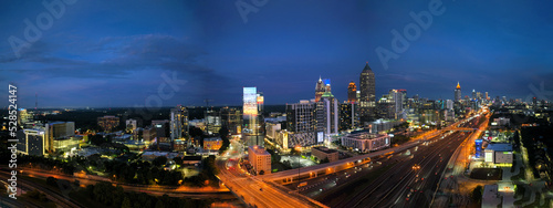 Cuadro en lienzo Panorama shot of Midtown Atlanta Georgia,  Night lights at sunset with traffic a twilight blue skies