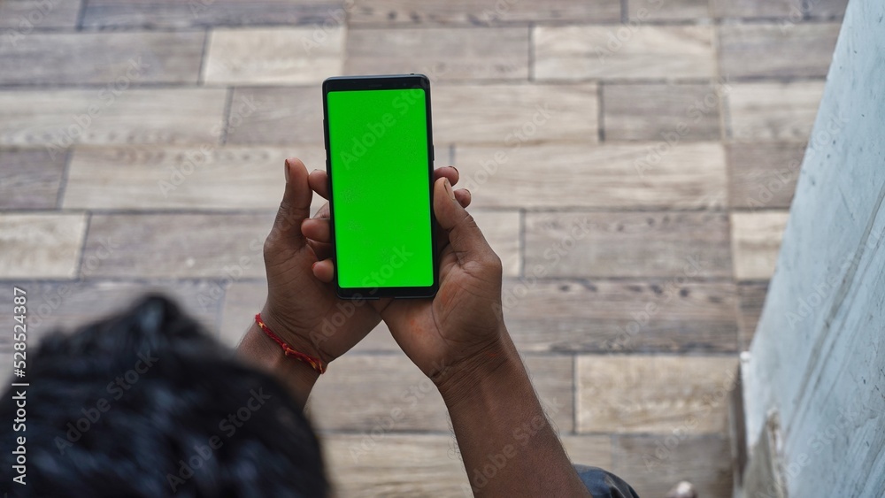 Businessman hand holding black smartphone isolated on white background ...