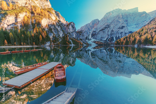 Boats on the Braies Lake ( Pragser Wildsee ) in Dolomites mountains, Sudtirol, Italy.  Alps nature landscape