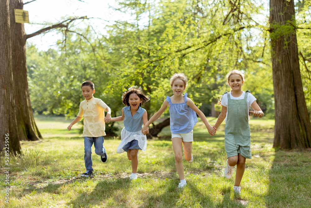 Group of asian and caucasian kids having fun in the park Group of asian and caucasian kids having fun in the park