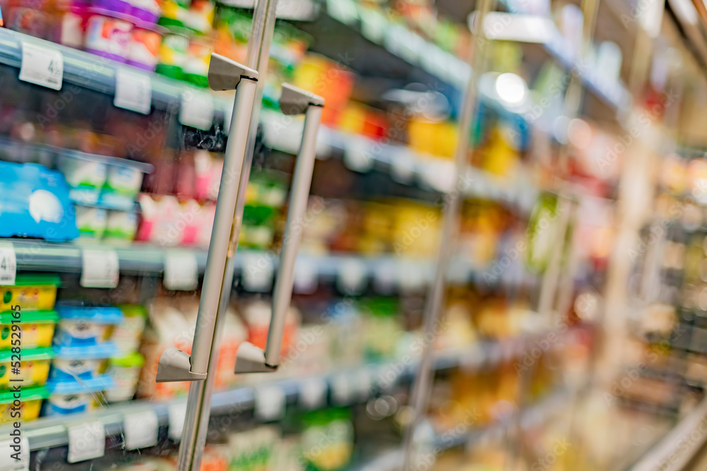 Fototapeta premium Food products displayed in a commercial refrigerator