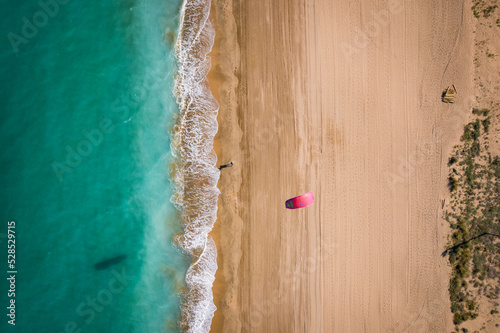 Vista cenital de una cometa de kite surf, en la playa de Peñíscola. photo