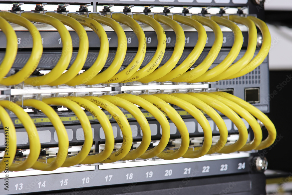 Connecting an Ethernet switch using patch cords with RJ45 connectors for data transmission in the data center.