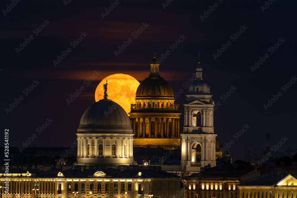 Full moon on the background of the cathedrals in st. petersburg