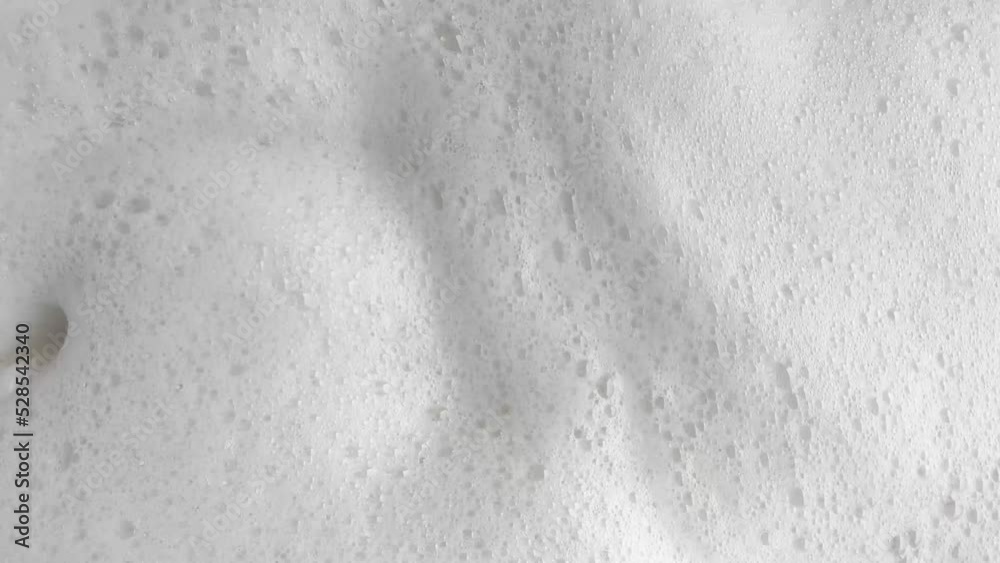 white soap bubbles in bathtub 