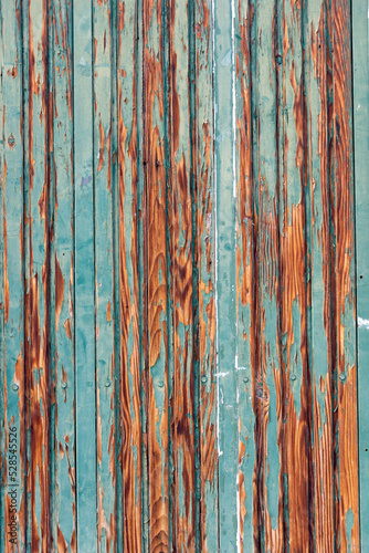 Old damaged wooden fence background. 