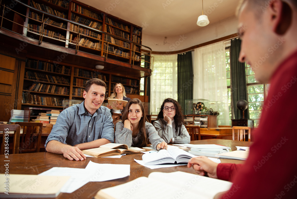 Group of students studying together at the University library Group of students studying together at the University library