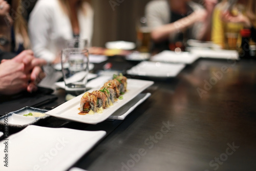 Concept photo of people waiting for food at a teppanyaki restaurant, selective focus