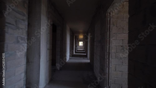 Wallpaper Mural Camera moves through construction site through dark corridor. Apartment building under construction. Developer, real estate investment. concrete monolithic piles. Torontodigital.ca