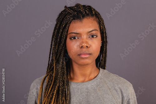 Tableau sur toile Young afro brazilian woman, close up photo, showing facial expression