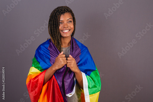 Young Afro Brazilian woman, wearing LGBT, LGBTQ, militancy, bisexual flag. diversity. Lesbian. photo