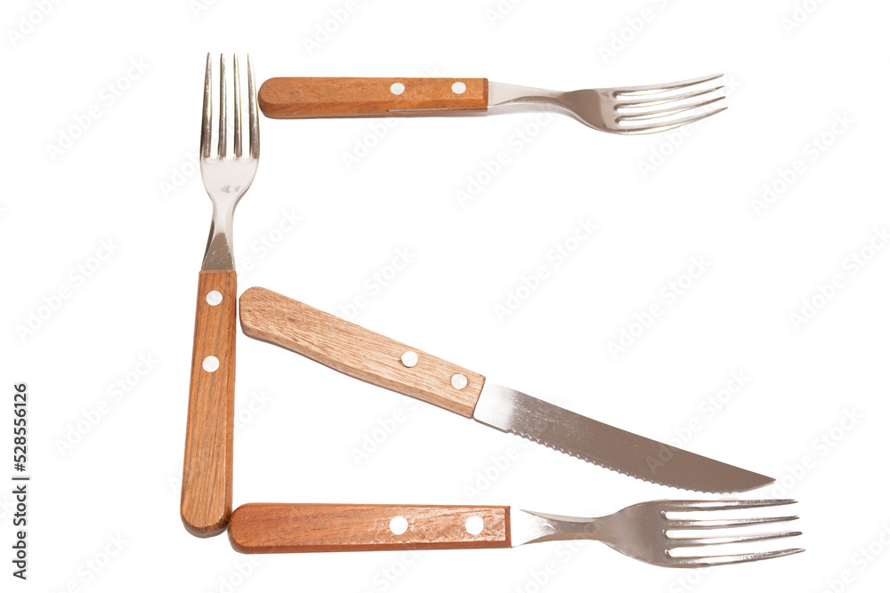 Naklejka premium 3 forks and 1 knife with wooden handle making the letter G on a white background