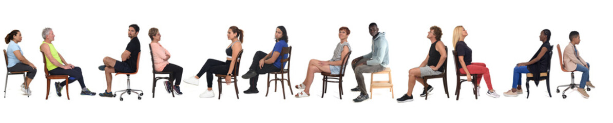 side view of a large group of people dressed in sports and casual clothes sitting on chair over white background