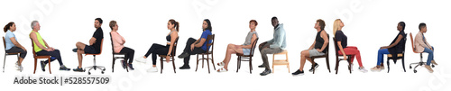 side view of a large group of people dressed in sports and casual clothes sitting on chair over white background