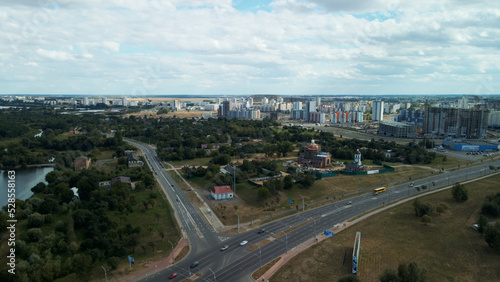 Multi-lane city highway. Multi-storey buildings in the suburbs. Aerial photography.