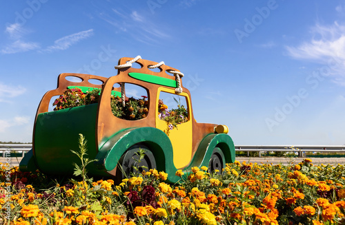 Flower bed in the form of car or vehicle 