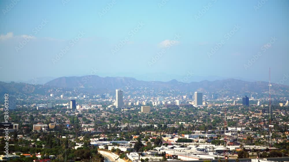 Aerial Lockdown Shot Of Residential Buildings Amidst Trees In City By Mountains On Sunny Day - Santa Monica, California Aerial Lockdown Shot Of Residential Buildings Amidst Trees In City By Mountains On Sunny Day - Santa Monica, California