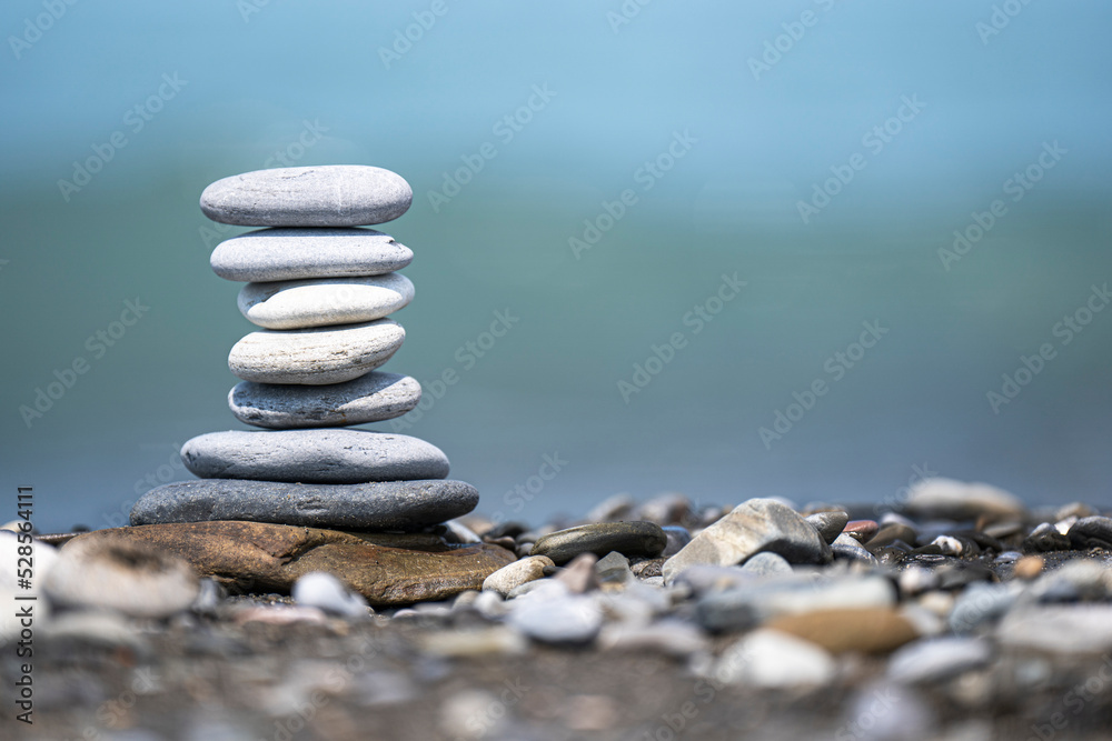 Pyramid of smooth stones on the coastline Pyramid of smooth stones on the coastline