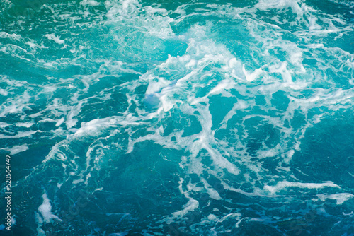 Bild auf Leinwand Turquoise abstract of sea surface with turbulent foamy water