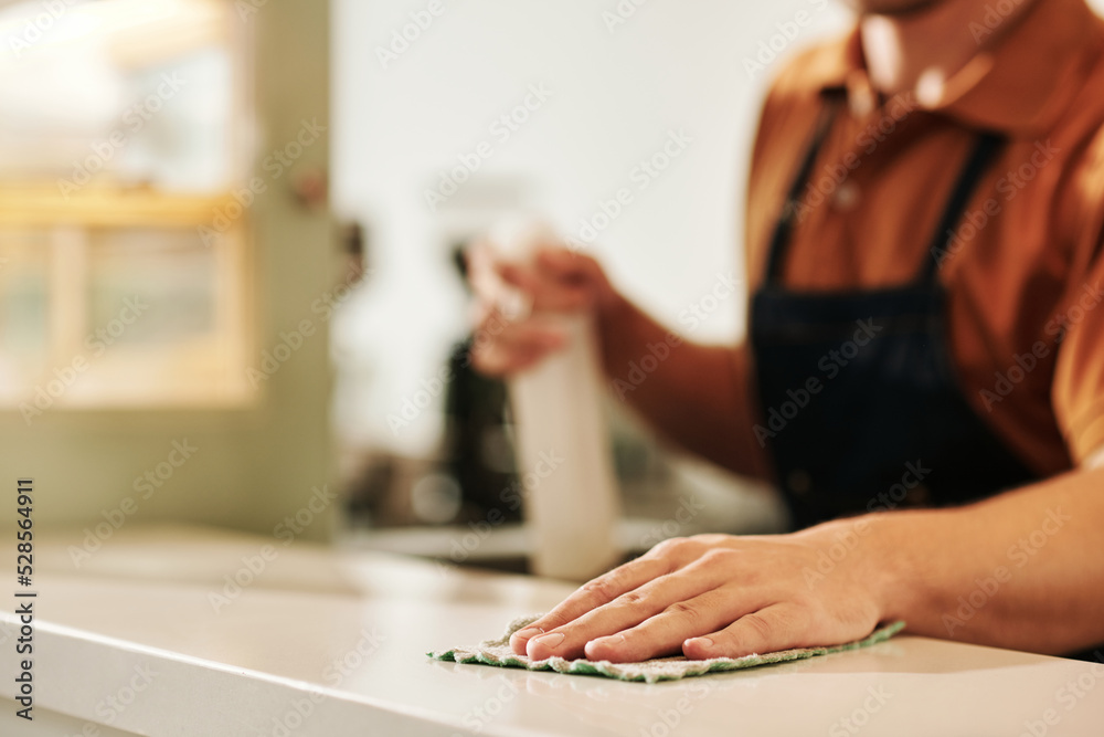 Cafe Worker Wiping Counter