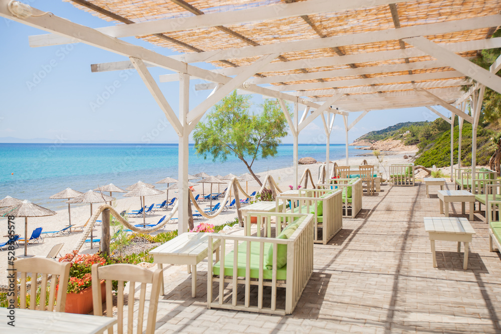 Waterfront Restaurant. Beachfront View. Summer Seascape. Picture-perfect Postcard Moment. Feast For Eyes. Overlooking the Aegean Twinkling Blue Waves.	
