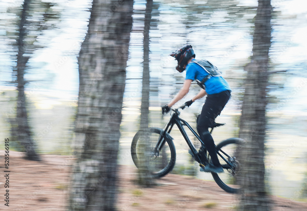 Teenager in forest practicing downhill biking. Teenager in forest practicing downhill biking.