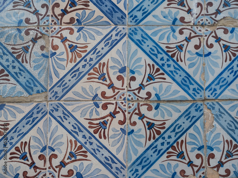 Blue and brown ceramic tiles from facade of old houses in Lisbon Portugal. Portuguese traditional Azulejos decorative artistic design background, creative texture surface Blue and brown ceramic tiles from facade of old houses in Lisbon Portugal. Portuguese traditional Azulejos decorative artistic design background, creative texture surface