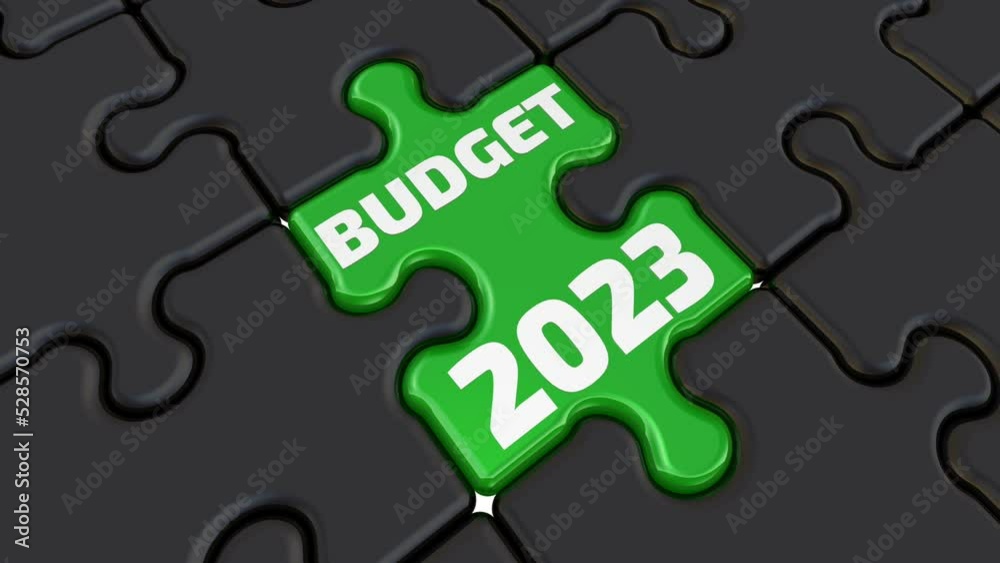 The budget of 2023. The inscription on the green element of the puzzle. Folded black puzzles elements and one green with white text BUDGET 2023. Footage video The budget of 2023. The inscription on the green element of the puzzle. Folded black puzzles elements and one green with white text BUDGET 2023. Footage video