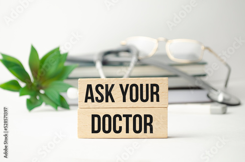 Ask your Doctor text message isolated on hospital clinic office background.