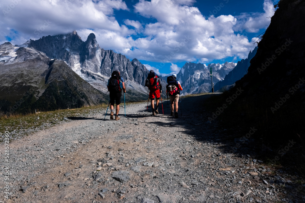 Chamonix, France - September 1, 2022: group of hikers walk towards La Flegere station