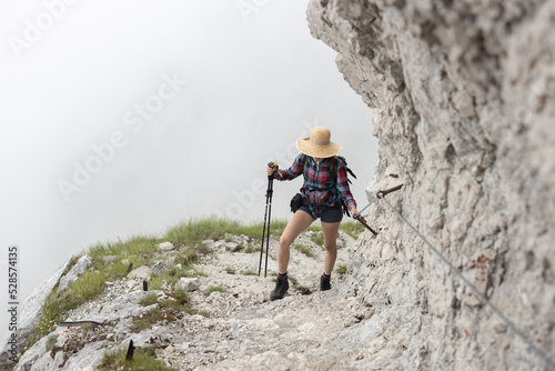 Steep Climb on Top of A Mountain For A Woman Backpacker Hiker