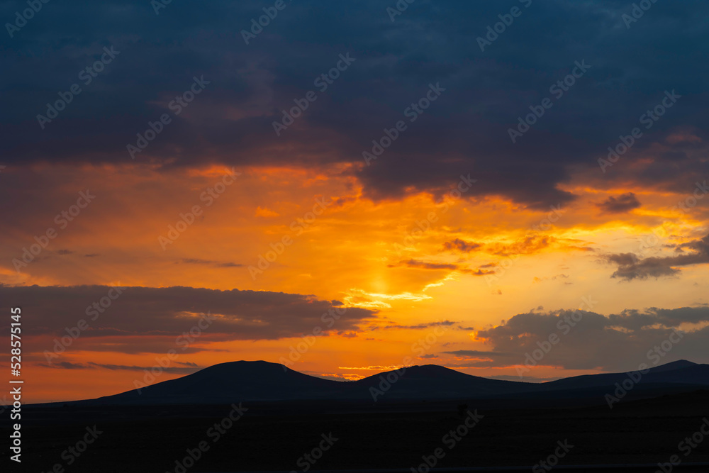 Inspirational quotes concept photo. Silhouette of hills at sunset or sunrise