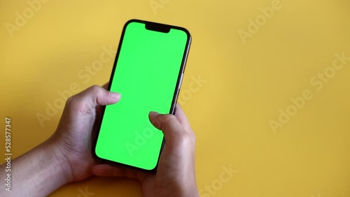 Child Using Phone With Green Mock-up. Surfing Internet Watching Content Videos Blogs Learning. boy Playing Video Games. chroma key for copy space. Slow motion.