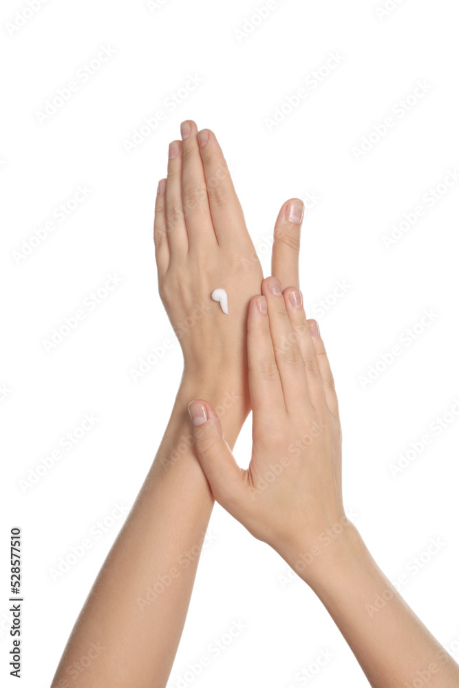 Woman applying cream on hand against white background, closeup Woman applying cream on hand against white background, closeup