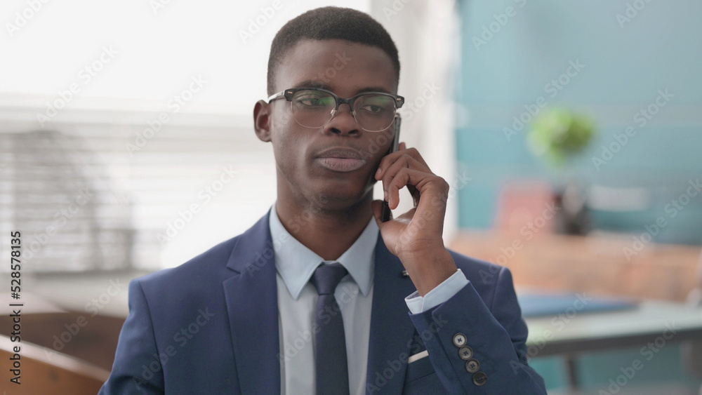 Young African Businessman Talking on Phone Young African Businessman Talking on Phone