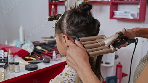 Wallpaper Mural happy vietnamese woman stylist and european woman makeup artist are working on creating an image for. close-up. Asian woman and work as a stylist. Torontodigital.ca