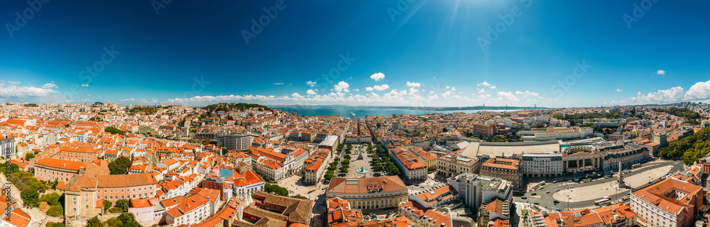 High definition Ultra wide angle aerial drone view of Baixa District in Lisbon, Portugal with major landmarks visible