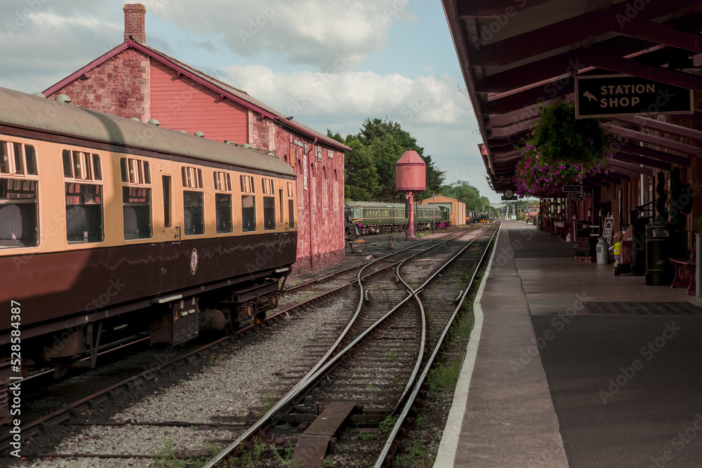 Restored Victorian-Era Passenger Rail train at a train station.