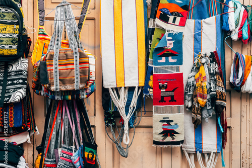 colorful scarfs pile at ecuadorian handcraft market