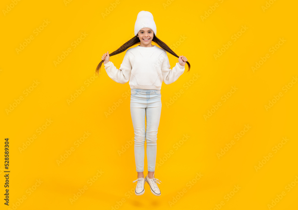 Excited face. Amazed expression, cheerful and glad. Happiness, freedom, motion and child. Young teenager girl wear summer dress jumping in air. Excited face. Amazed expression, cheerful and glad. Happiness, freedom, motion and child. Young teenager girl wear summer dress jumping in air.