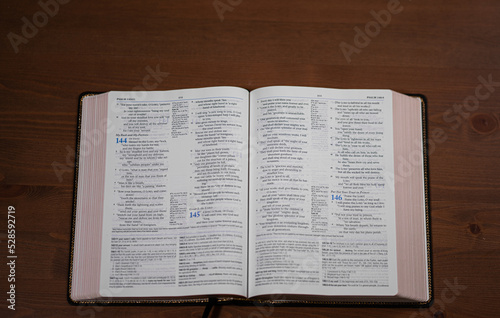 Top view of black bible with red edges