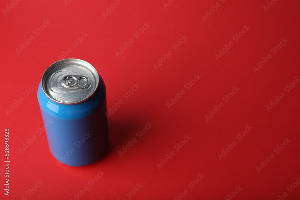 Blue can of energy drink on red background. Space for text Blue can of energy drink on red background. Space for text