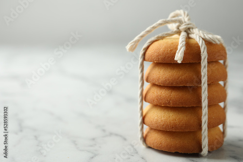 Canvastavla Tasty shortbread cookies on marble table, closeup. Space for text