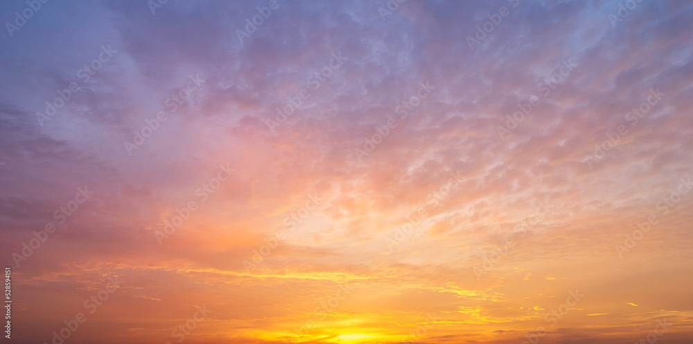 Panoramic background of sky covered with colorful clouds. during twilight time before sunrise